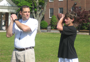 A coach giving instruction to an older student