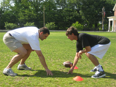 A coach giving instruction to an older student
